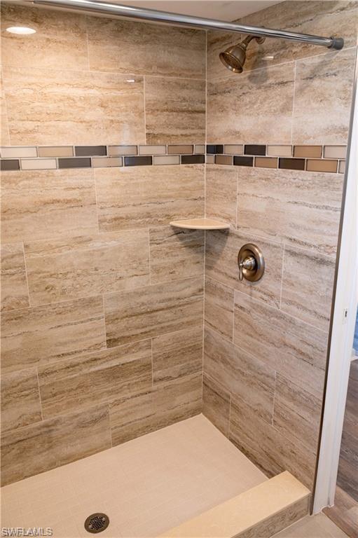 5654 Eichen Circle Fort Myers, FL 33919 - Photo 9 of 47 Bathroom with a tile shower