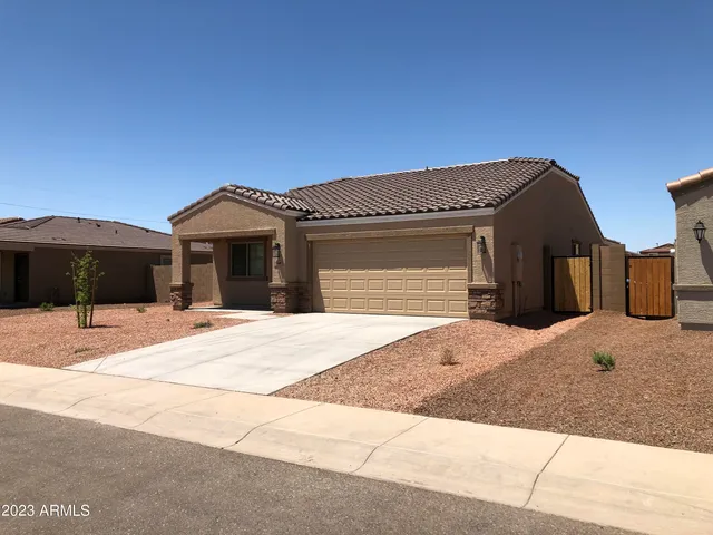 a front view of a house with a garage