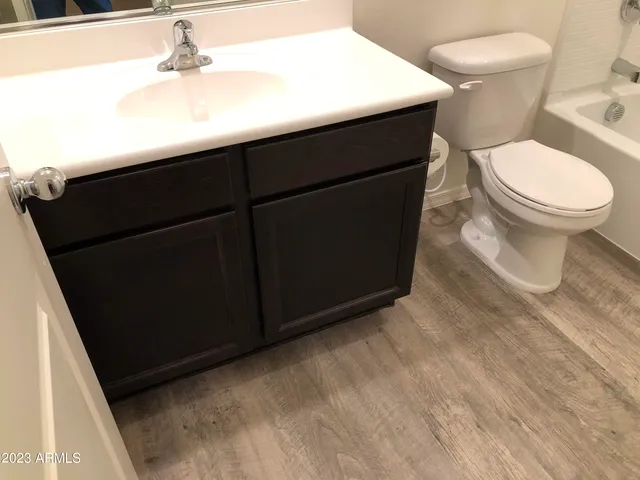 a bathroom with a shower and toilet