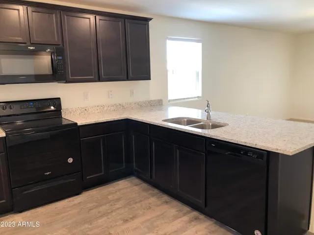 a kitchen with a sink and cabinets