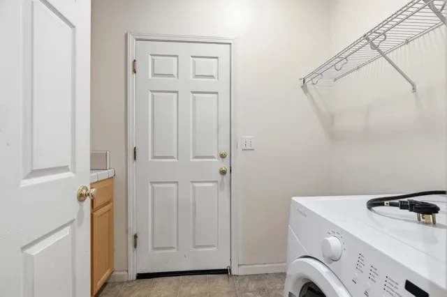 a view of storage and utility room with washer and dryer