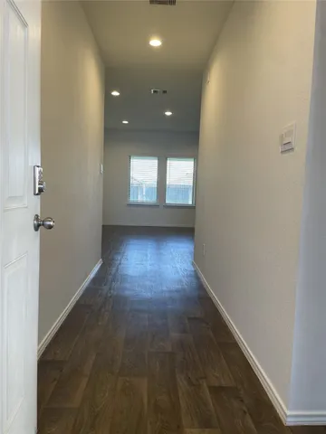 a view of hallway with a window