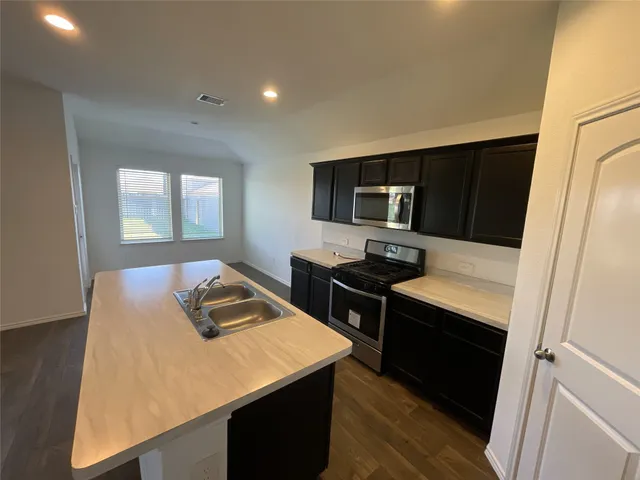 a view of kitchen island wooden floor