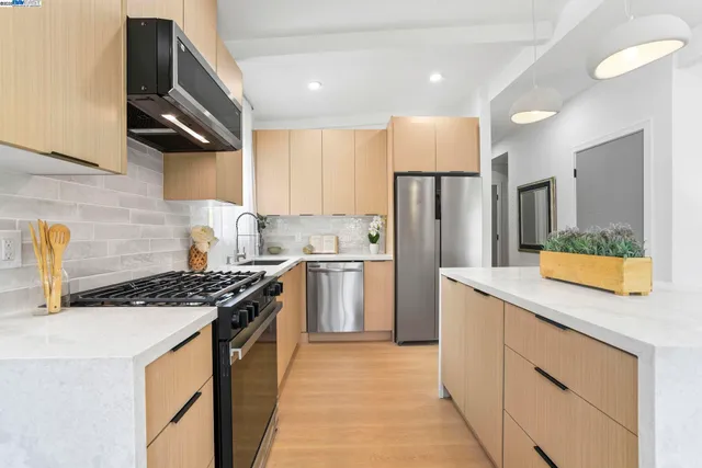 a kitchen with a table and chairs in it