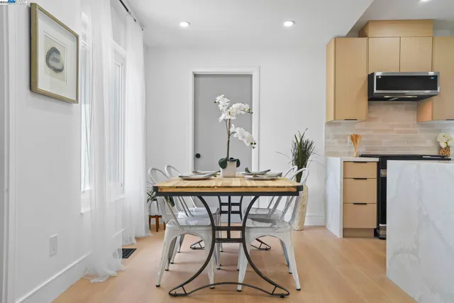 a living room with furniture flowerpot and window