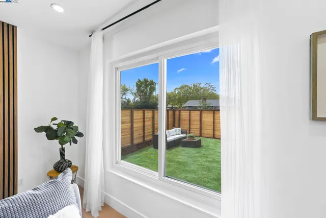 a bedroom with a bed and a table