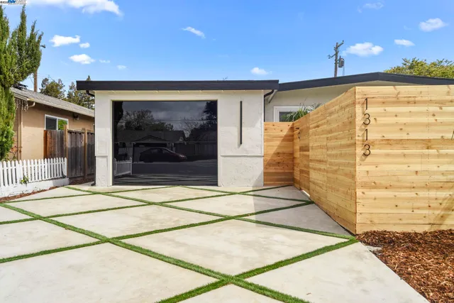 a view of a backyard with a garden and plants