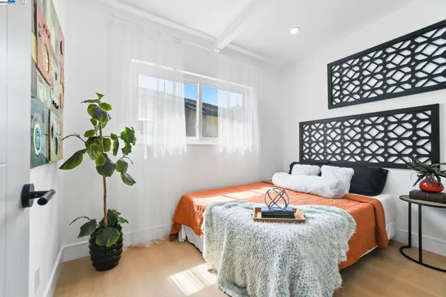 a view of a house with backyard and a tree