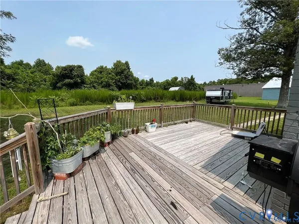 a view of a patio with table and chairs
