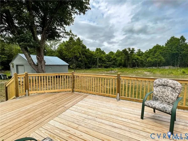 a living room with lots of furniture and kitchen view