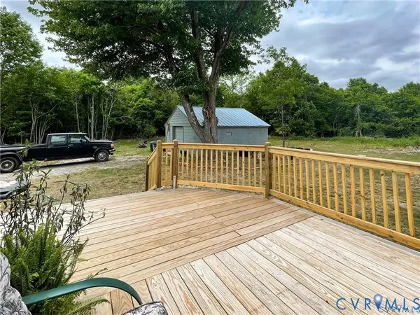 a view of a livingroom with furniture and a workspace