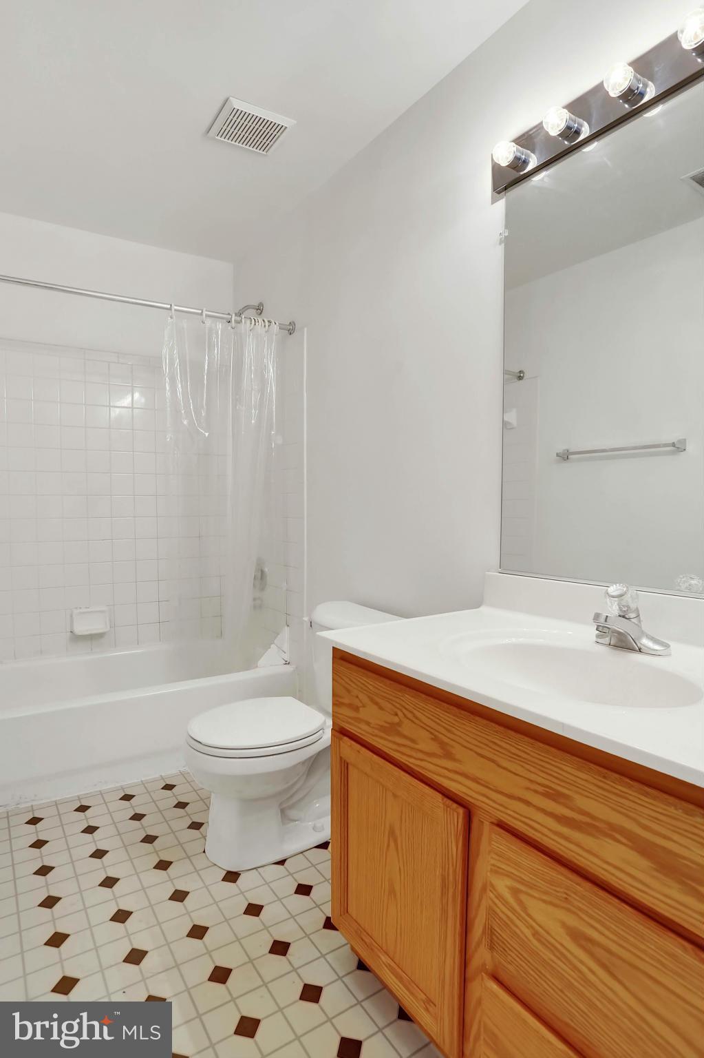 8724 Autumn Ridge Court Odenton, MD 21113 - Photo 16 of 24 a bathroom with a sink a toilet and a bathtub