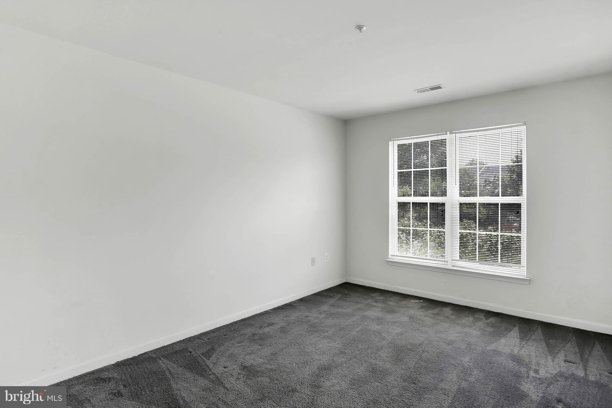 8724 Autumn Ridge Court Odenton, MD 21113 - Photo 17 of 24 an empty room with a window