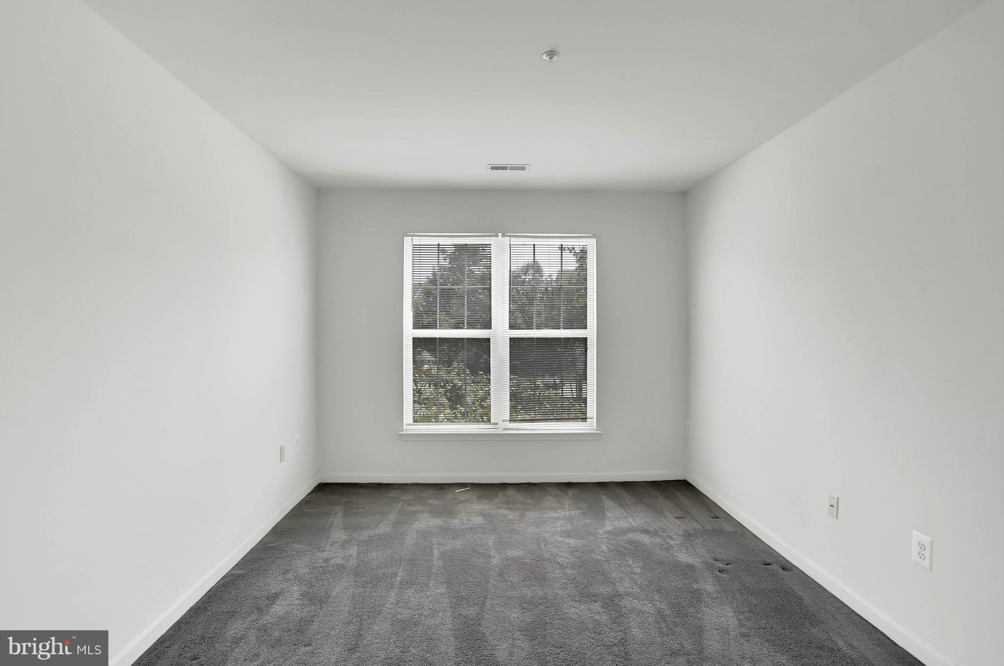 8724 Autumn Ridge Court Odenton, MD 21113 - Photo 18 of 24 an empty room with a window