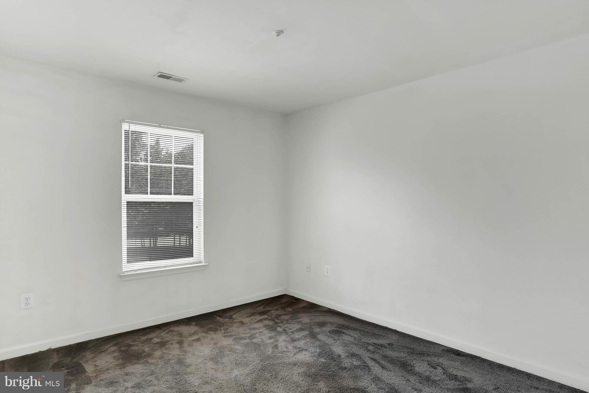 8724 Autumn Ridge Court Odenton, MD 21113 - Photo 21 of 24 an empty room with a window