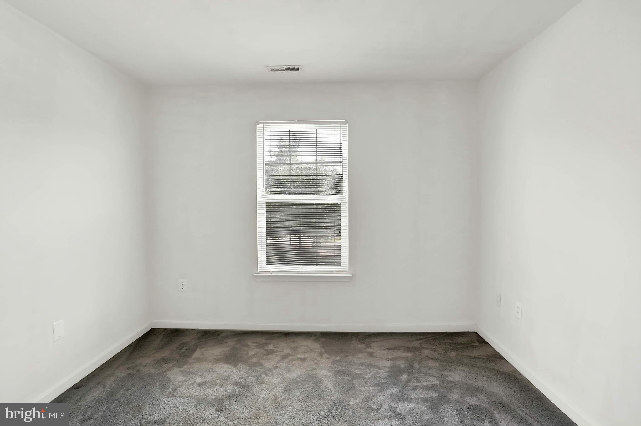 8724 Autumn Ridge Court Odenton, MD 21113 - Photo 22 of 24 an empty room with a window