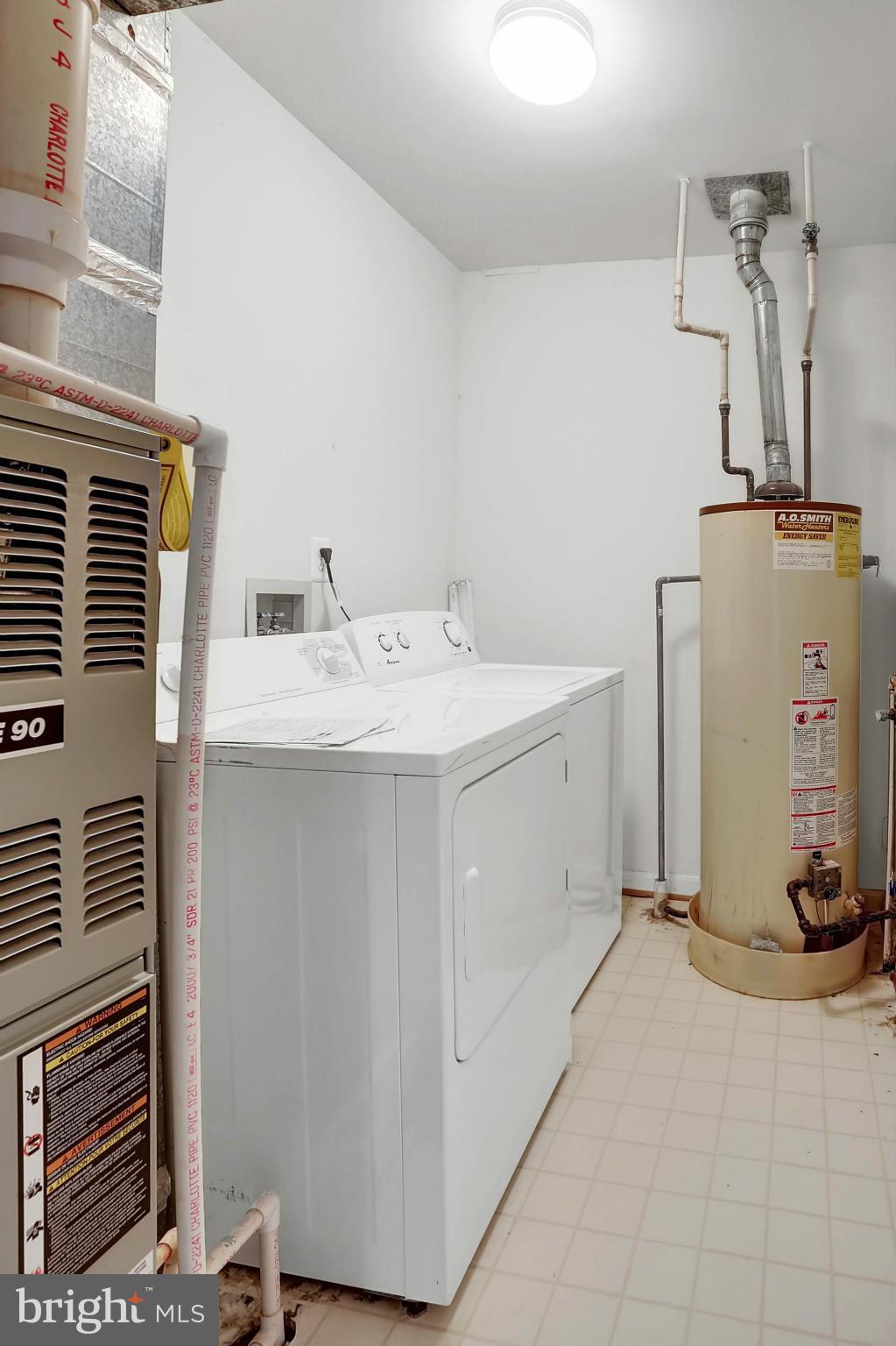 8724 Autumn Ridge Court Odenton, MD 21113 - Photo 23 of 24 a utility room with a washer dryer and buildings