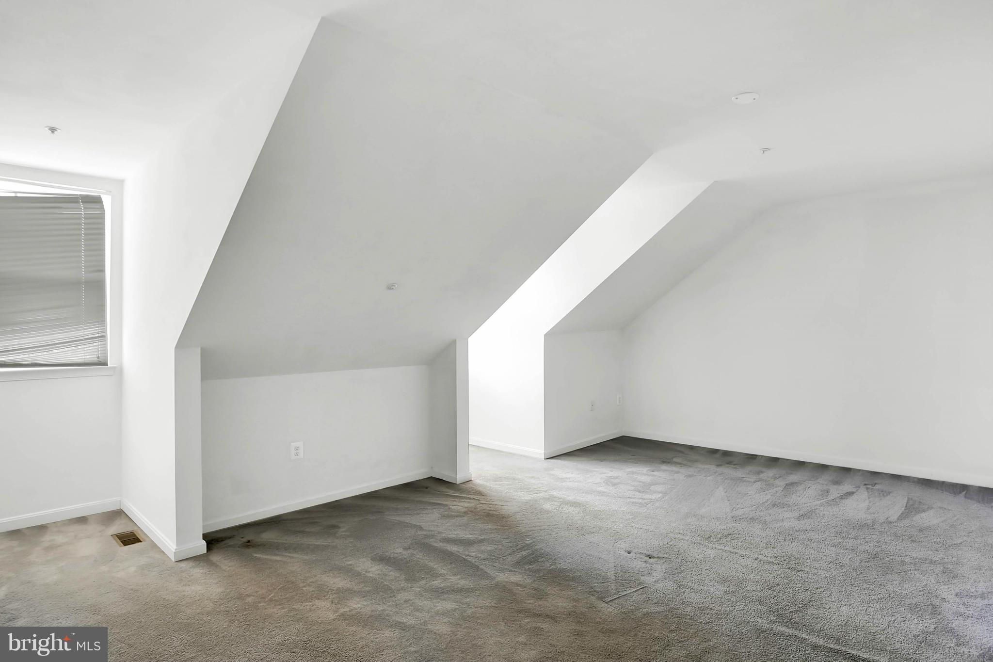 8724 Autumn Ridge Court Odenton, MD 21113 - Photo 6 of 24 a view of an empty room with stairs