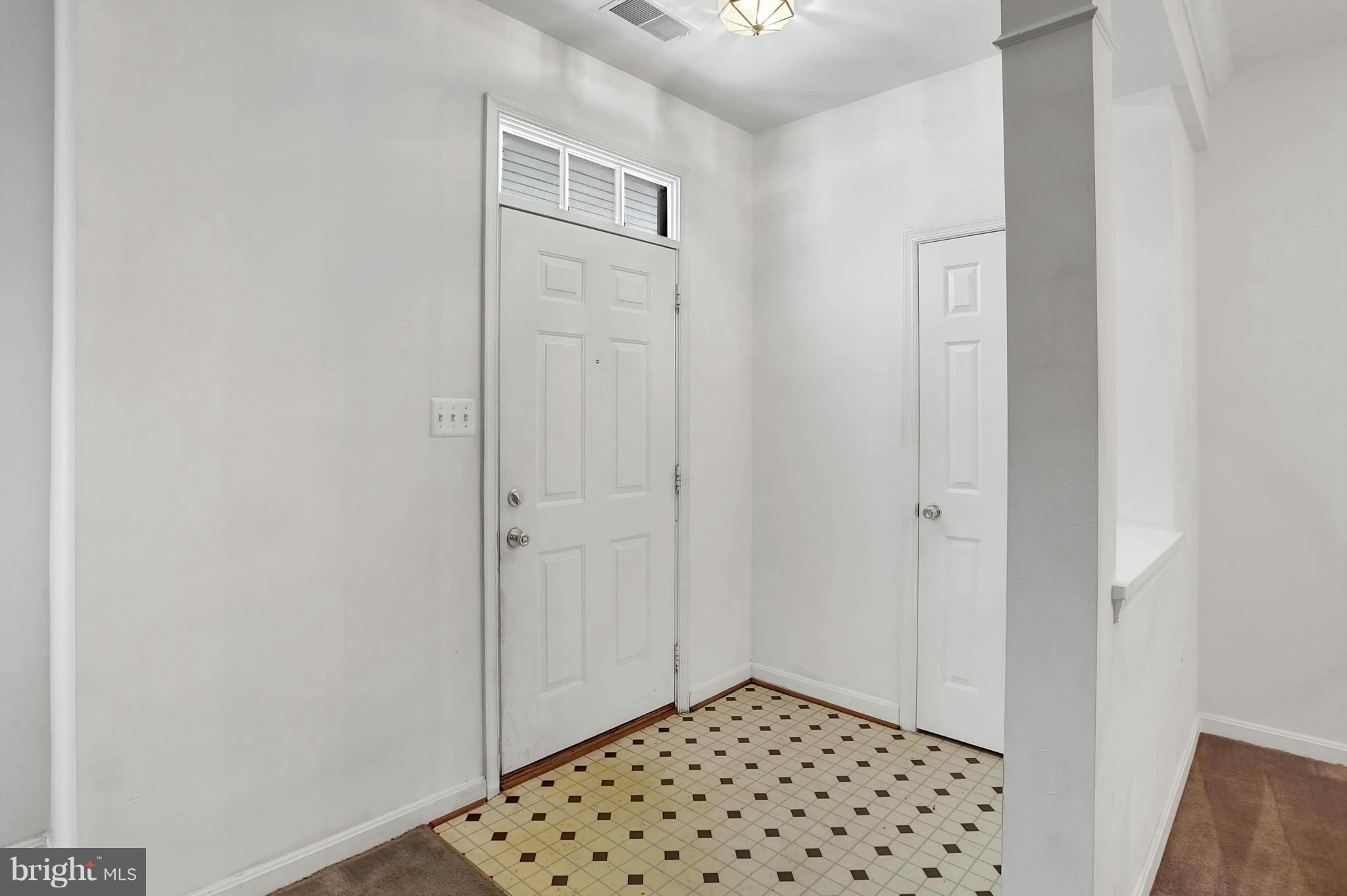 8724 Autumn Ridge Court Odenton, MD 21113 - Photo 7 of 24 a view of a closet area with wooden floor