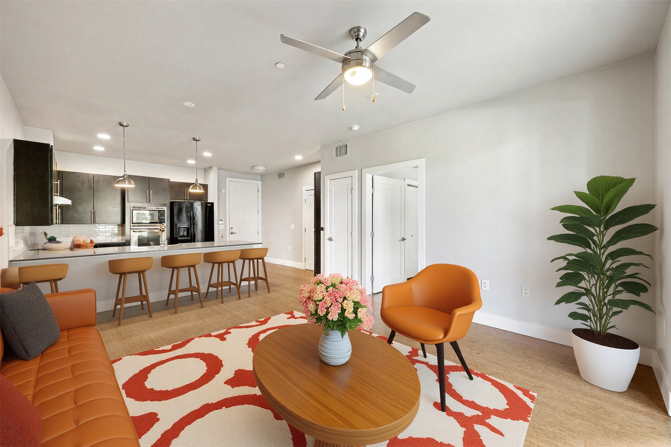 2804 Treble Lane, Unit 902 Austin, TX 78704 - Photo 15 of 31 a living room with furniture potted plant and a chandelier