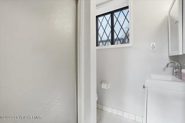 a kitchen with stainless steel appliances kitchen island granite countertop a refrigerator and a stove top oven