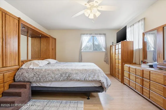 a bathroom with a sink vanity and mirror
