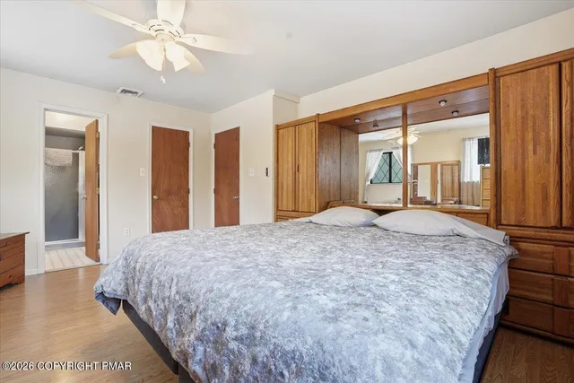 a white toilet sitting next to a white sink