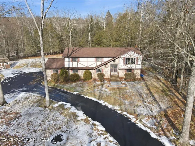 a bathroom with a window and a sink