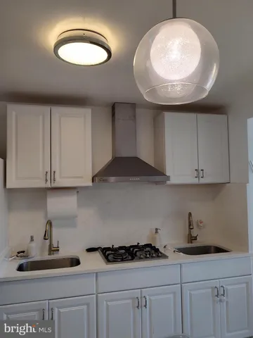 a kitchen with cabinets and appliances