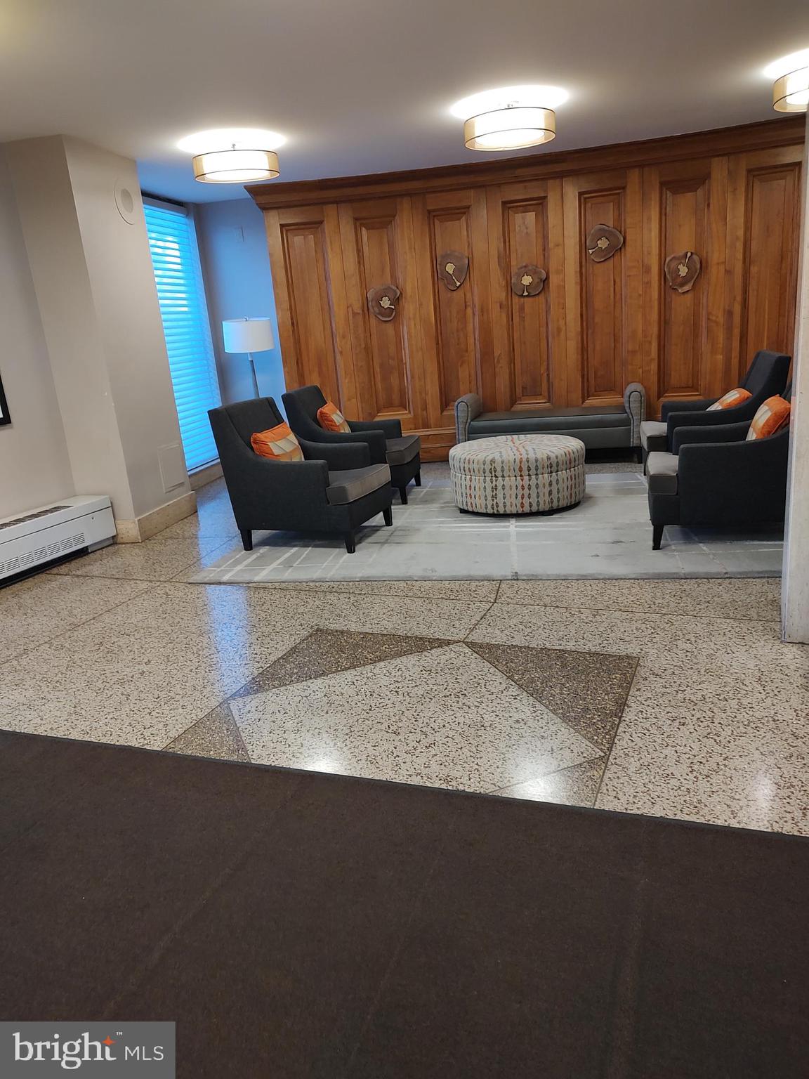 1111 University Boulevard West, Unit 719A Silver Spring, MD 20902 - Photo 27 of 41 a living room with furniture a couch and a window