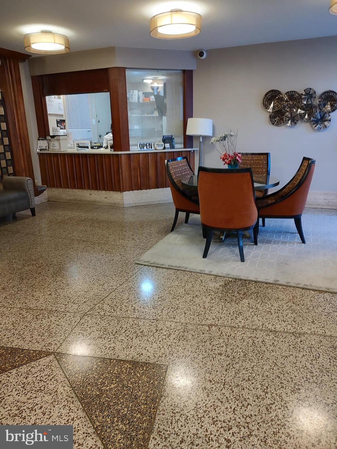 1111 University Boulevard West, Unit 719A Silver Spring, MD 20902 - Photo 29 of 41 a living room with furniture a rug and a window