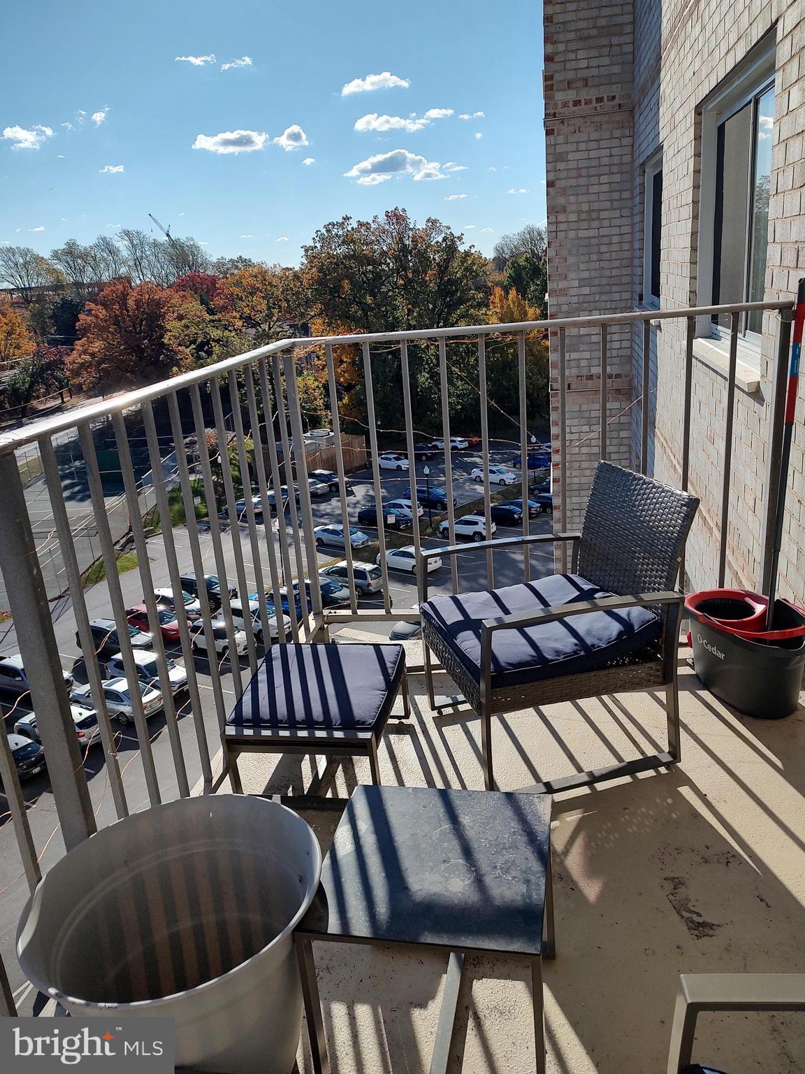 1111 University Boulevard West, Unit 719A Silver Spring, MD 20902 - Photo 5 of 41 a view of a chairs and table in the balcony