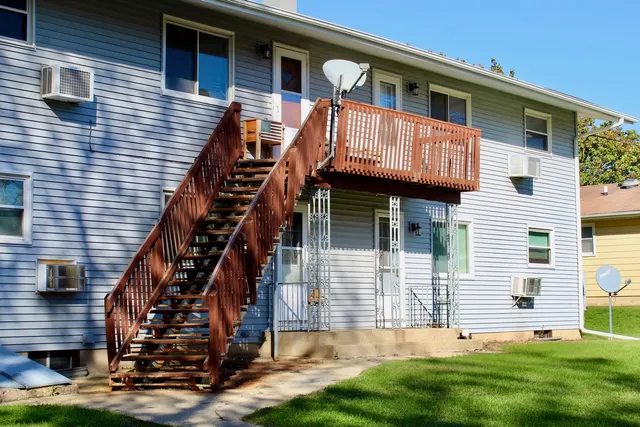 a view of front of house with a yard