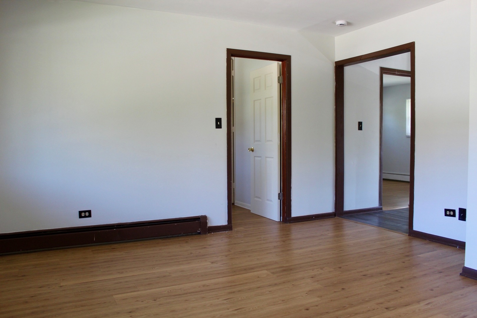 321 South Avenue, Unit C Hampshire, IL 60140 - Photo 4 of 15 a view of an empty room with wooden floor and closet