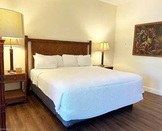 a bedroom with a bed and dresser