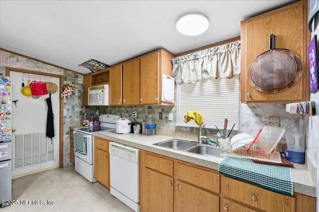 a kitchen with a sink and a stove