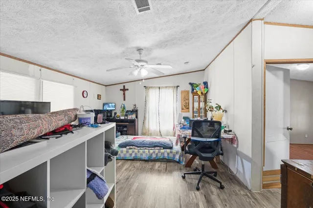 a view of a kitchen and dining room with wooden floor