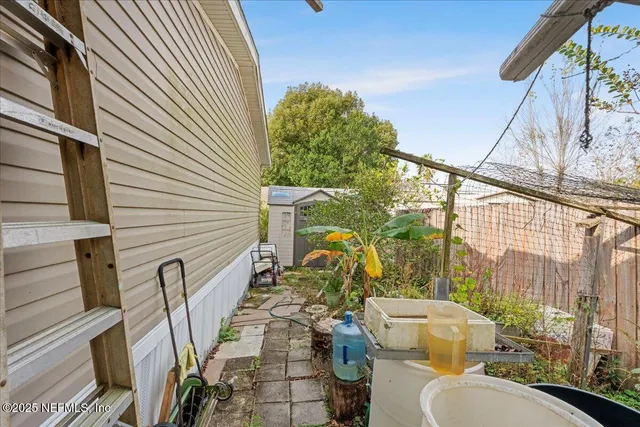 a view of a backyard with plants