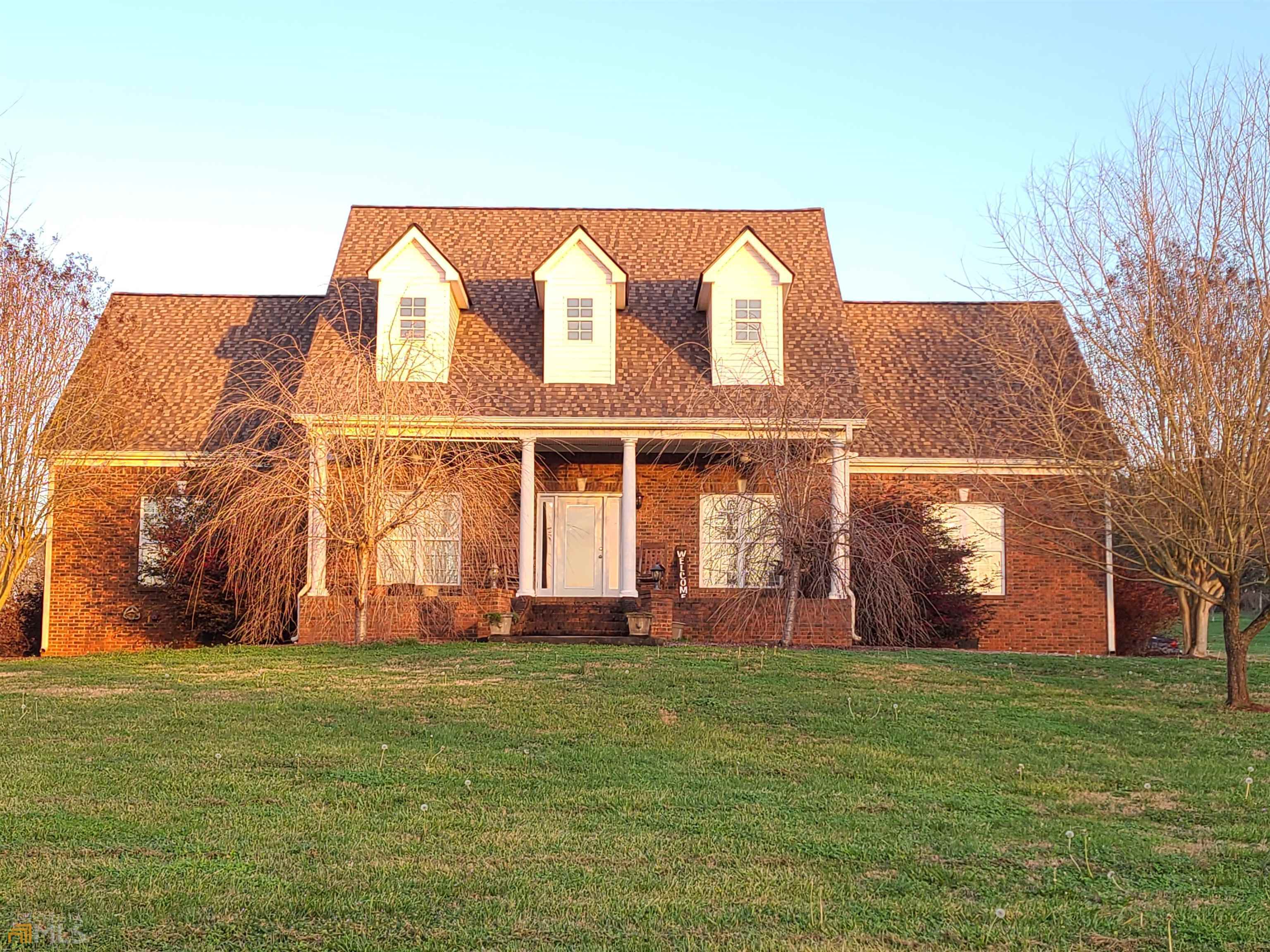 465 Highway 5 Roopville, GA 30170 - Photo 1 of 1 a front view of a house with a yard