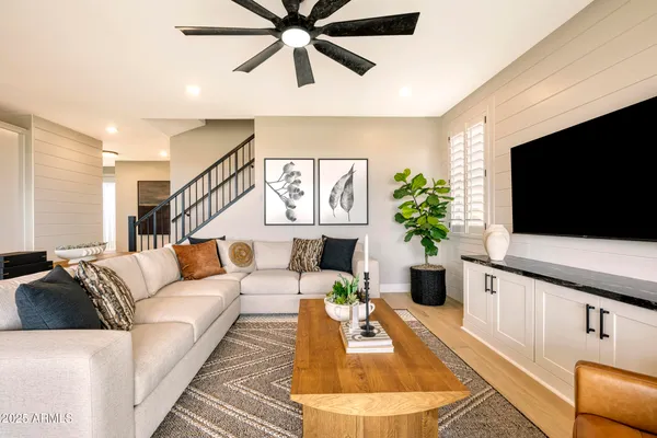 a living room with furniture and a flat screen tv