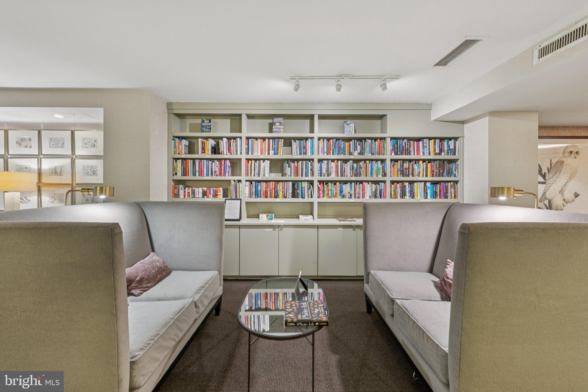 4100 Cathedral Avenue Northwest, Unit 406 Washington, DC 20016 - Photo 22 of 30 a living room with furniture and a book shelf