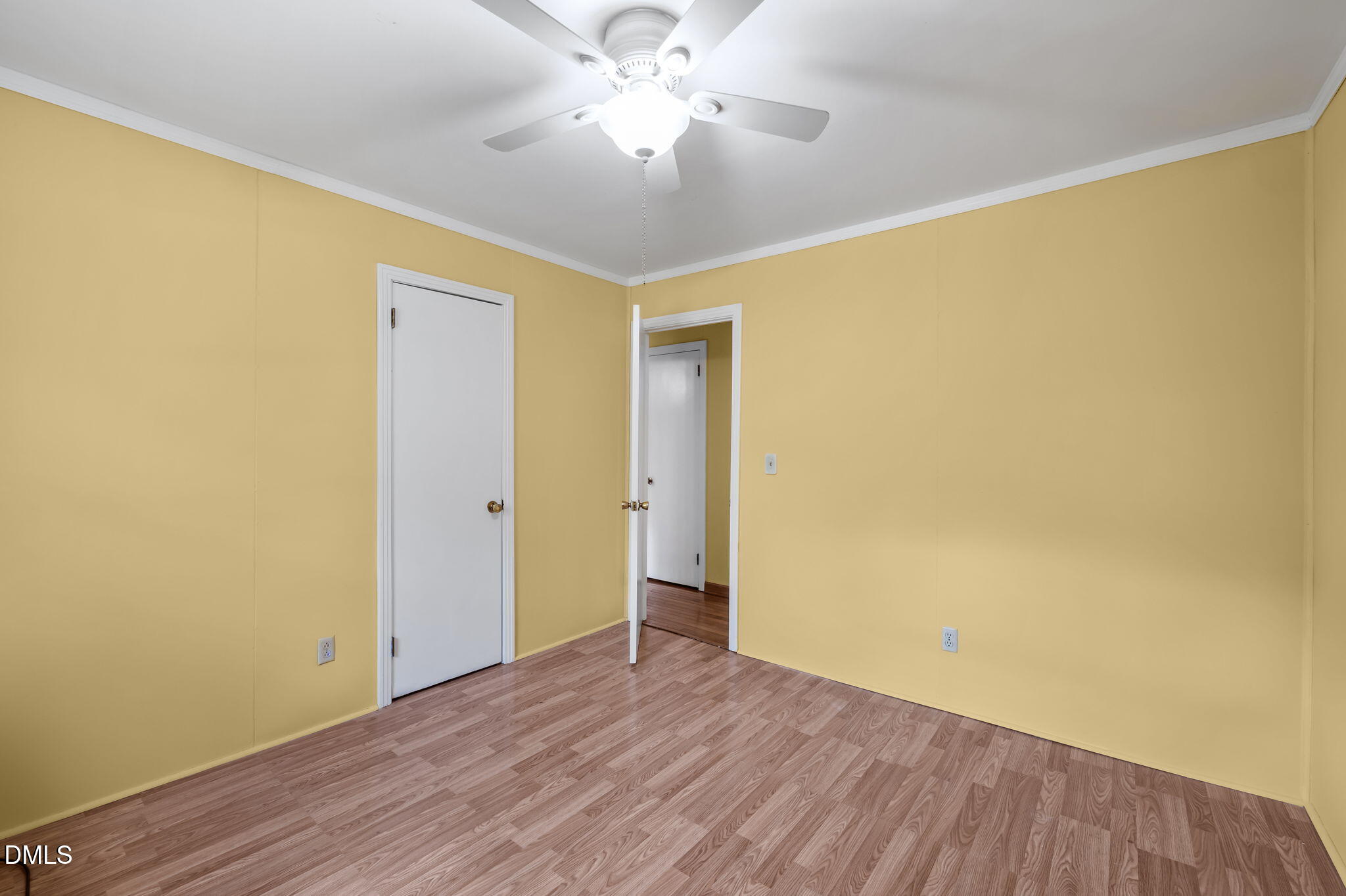 95 Harold Gill Road Roxboro, NC 27574 - Photo 17 of 53 a view of a big room with wooden floor and a ceiling fan