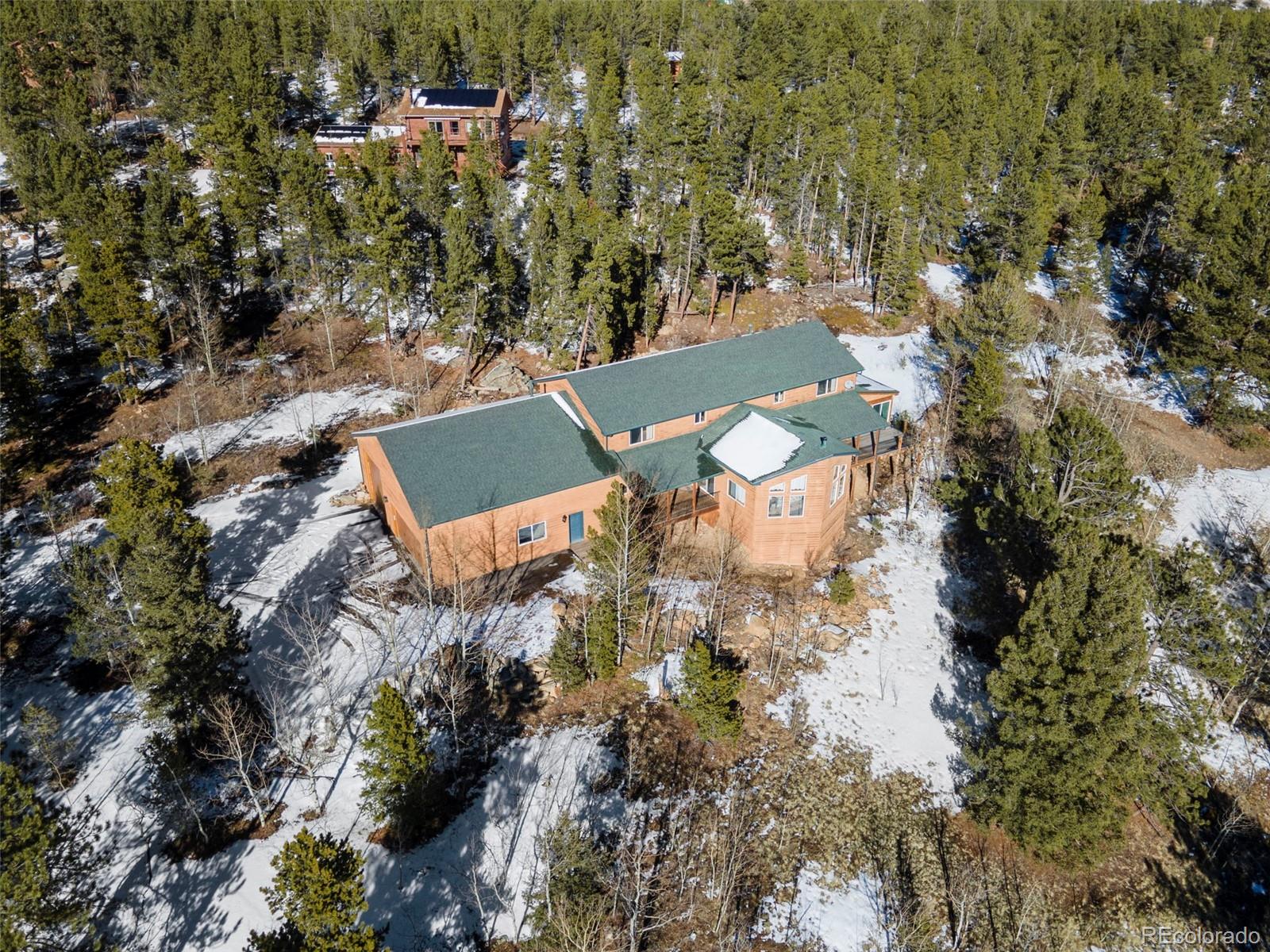 412 Evergreen Road Black Hawk, CO 80422 - Photo 48 of 48 an aerial view of a house with a yard and lake view