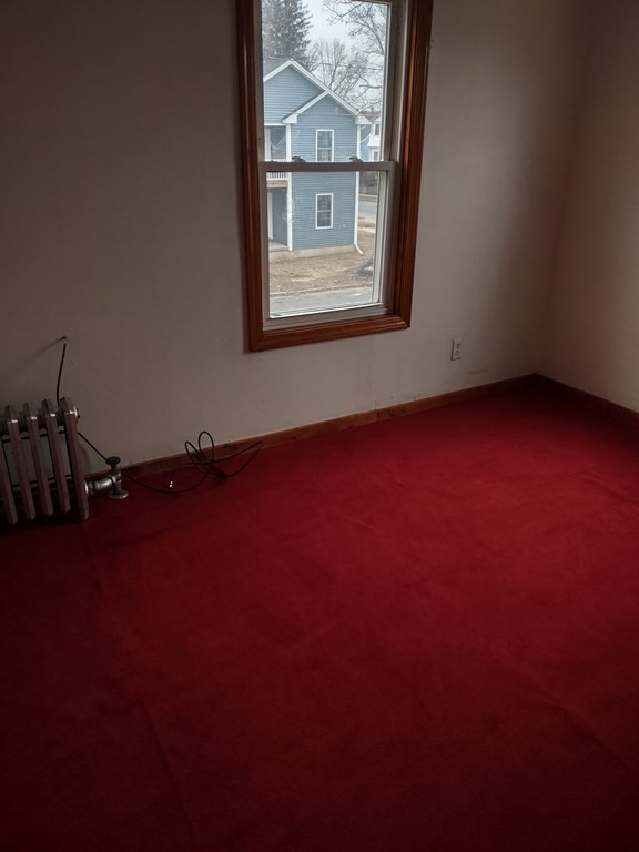 112 Marlborough Street Springfield, MA 01109 - Photo 11 of 22 an empty room with a window