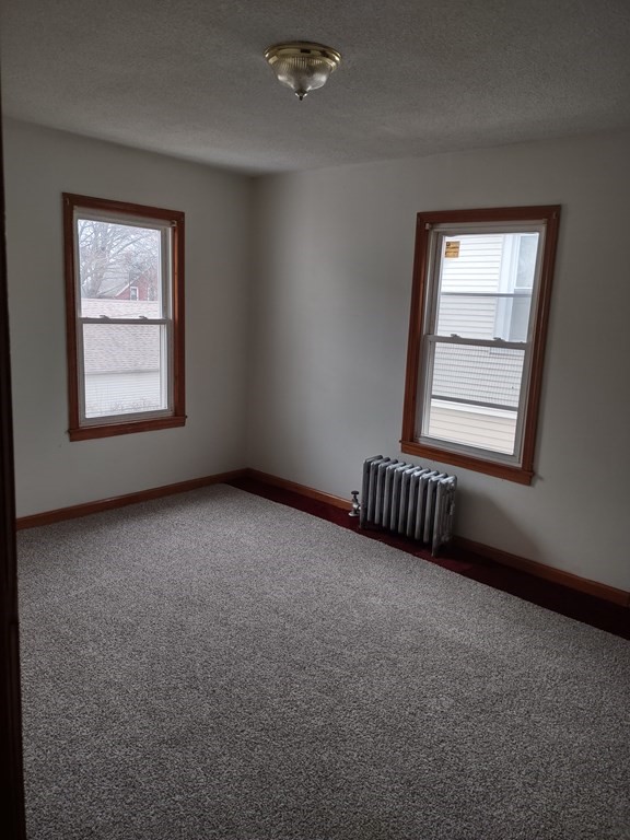 112 Marlborough Street Springfield, MA 01109 - Photo 12 of 22 an empty room with windows and closet
