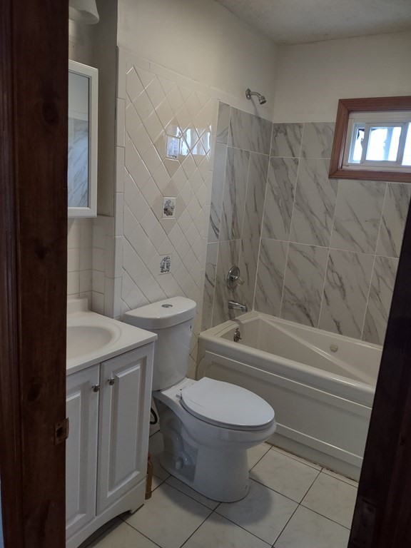 112 Marlborough Street Springfield, MA 01109 - Photo 14 of 22 a bathroom with a toilet a sink and bathtub