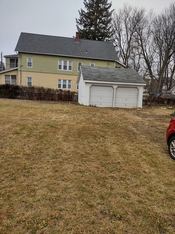 112 Marlborough Street Springfield, MA 01109 - Photo 21 of 22 a front view of a house with a yard