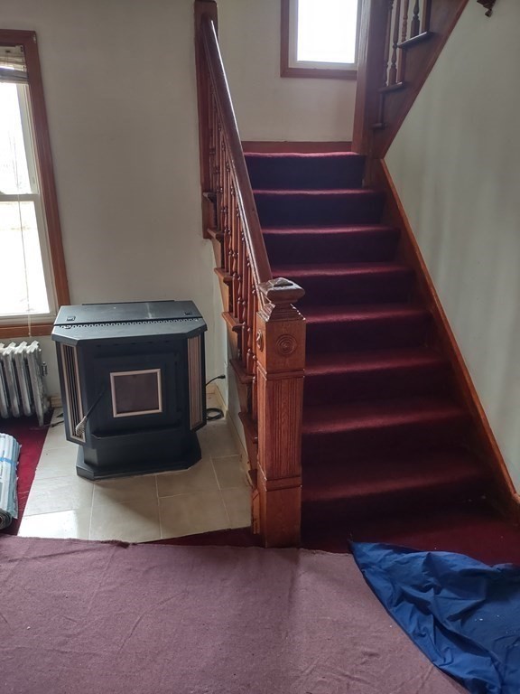 112 Marlborough Street Springfield, MA 01109 - Photo 4 of 22 a living room with furniture and a fireplace