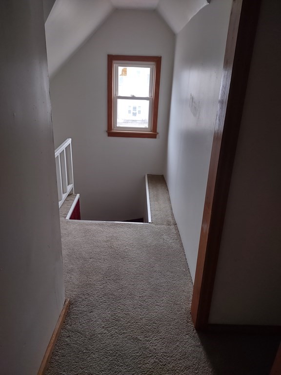 112 Marlborough Street Springfield, MA 01109 - Photo 9 of 22 a view of an empty room with wooden floor and a window