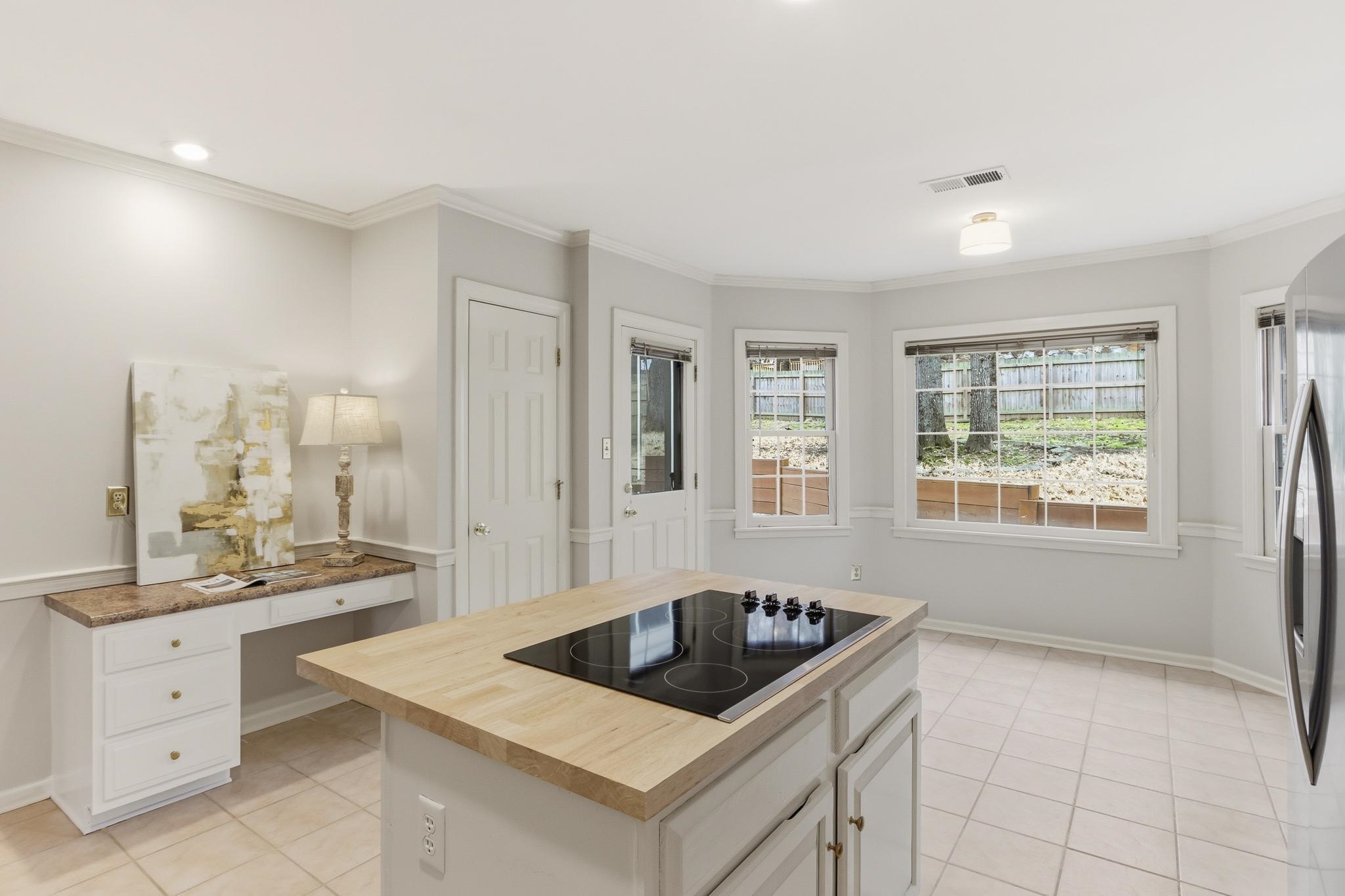 8372 Bazemore Road Cordova, TN 38018 - Photo 13 of 40 a kitchen with a stove a sink and a refrigerator